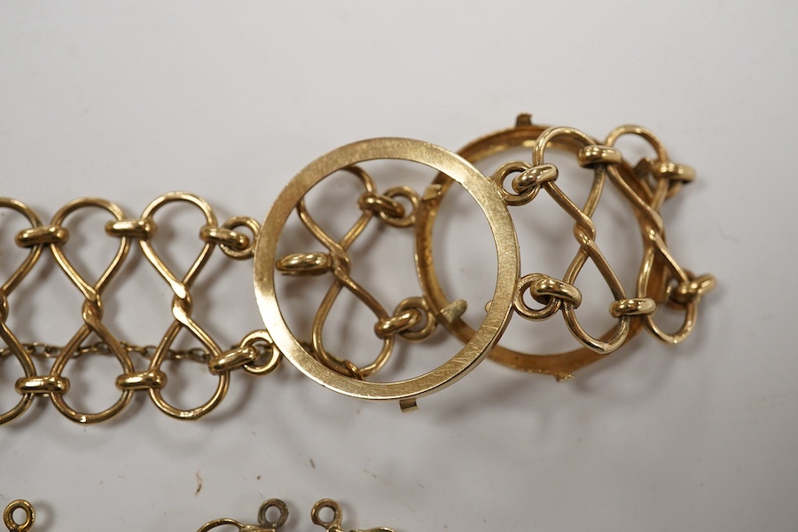 A 9ct gold coin bracelet (now lacking coins), one other 9ct gold coin mount and a similar yellow metal mount, gross weight 13.4 grams. Condition - poor to fair